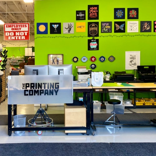 Custom apparel production workspace at The Printing Company