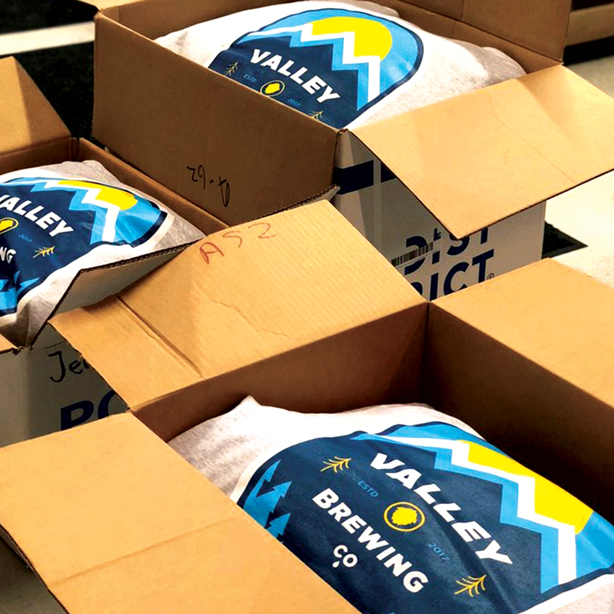 Custom printed t-shirts packed in a box